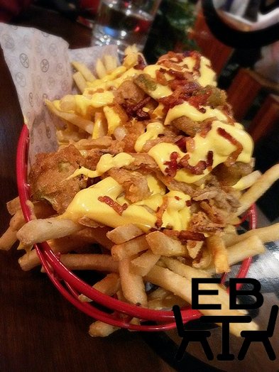 Garbage fries. Shoestring frieds with frickles (fried pickle coins), bacon, and cheese.