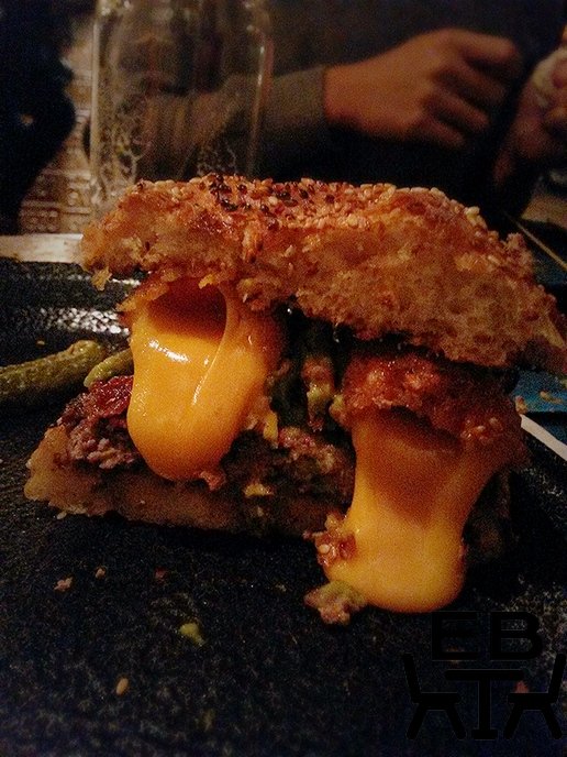 The 3am burger releasing its cheesy goodness.