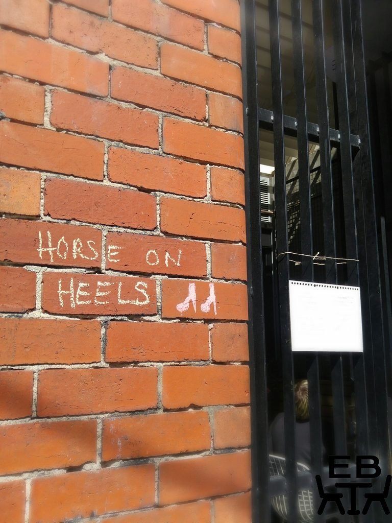 Horse on heels sign